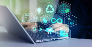 business man working on laptop with environmental icons